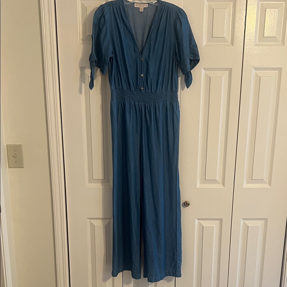 Michael Kors lightweight denim jumpsuit with tie sleeves.
Washes beautifully.